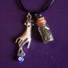 Necklace against the evil eye double pendant hand and glass vial filled with hyssop psychic protection plant spell green magic